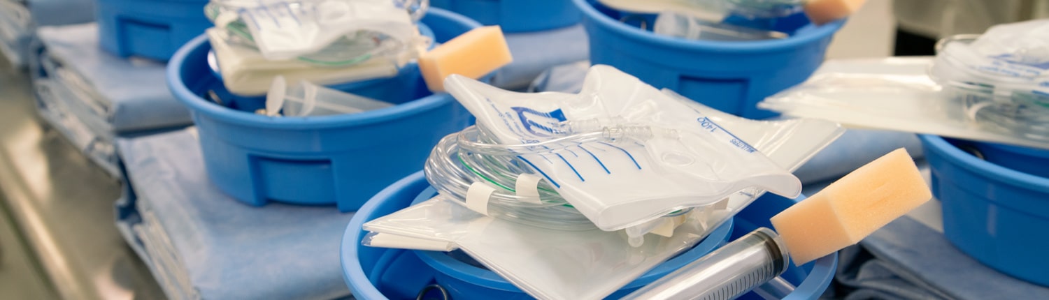 Medical device kits laid out on a table