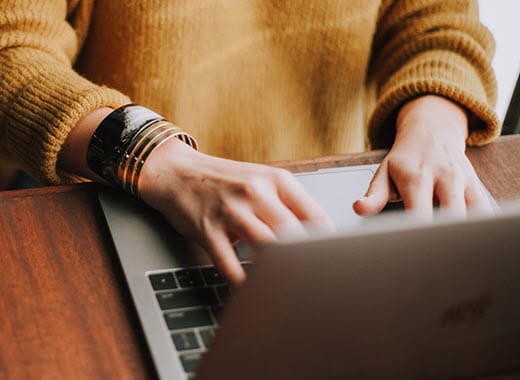 Secrets to Success- Person Typing on a Laptop