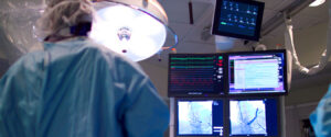 Surgeon performing treatment using medical imaging