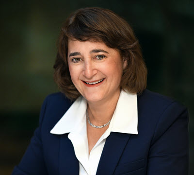 Martha Aronson, seated at a table, President and CEO Appointee, effective Oct 3, 2025